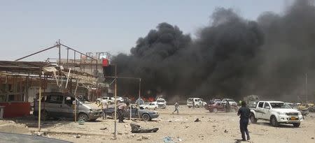 Smoke rises from the site of a car bomb attack in the town of Tuz Khurmato, north of the capital Baghdad, June 9, 2014. REUTERS/Ako Rasheed