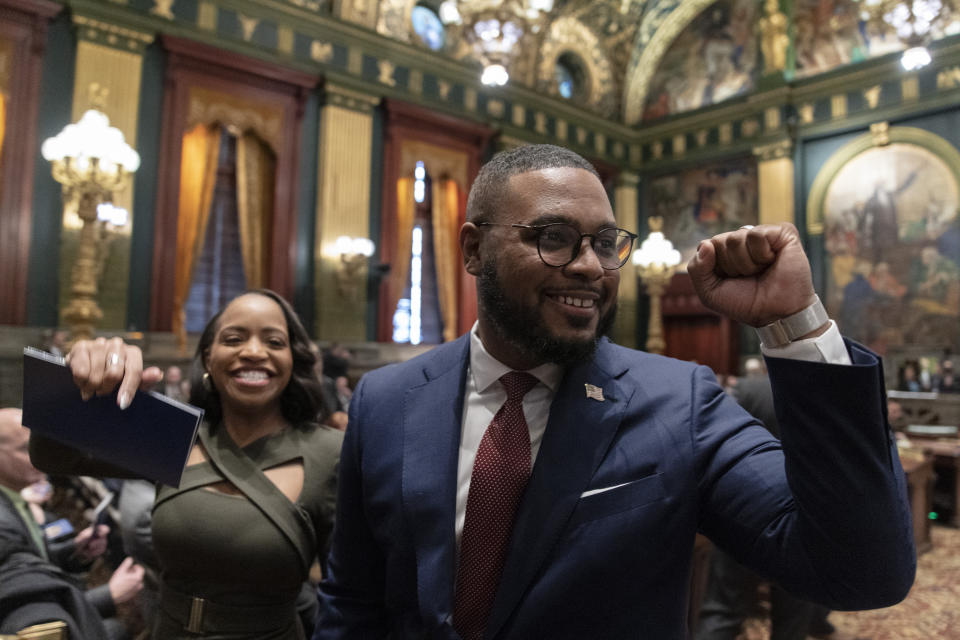 Democratic Lt. Gov. Austin Davis accompanied by his wife Blayre Holmes Davis departs from the Senate chambers after becoming Pennsylvania's first Black lieutenant governor, Tuesday, Jan. 17, 2023, at the state Capitol in Harrisburg, Pa. (AP Photo/Matt Rourke)