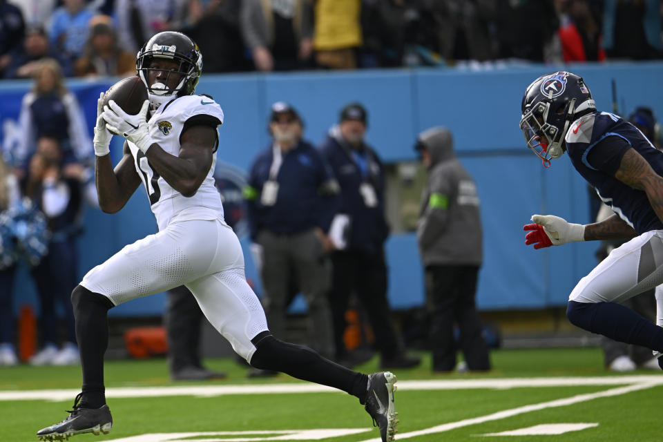 Jacksonville Jaguars wide receiver Calvin Ridley (0) catches a touchdown pass against the Tennessee Titans during the first half of an NFL football game Sunday, Jan. 7, 2024, in Nashville, Tenn. (AP Photo/John Amis)