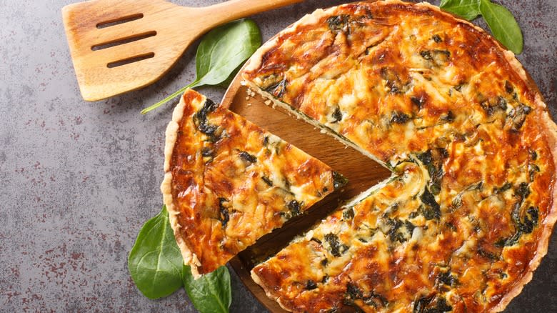 Quiche with a slice cut out