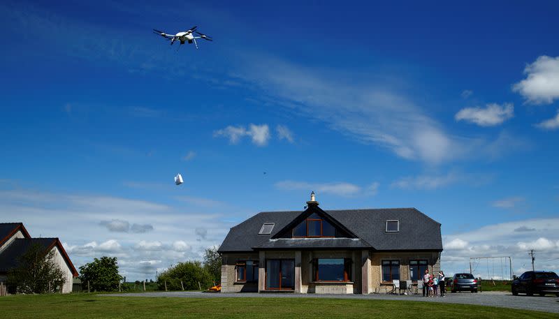 Residents receive a drone home delivery in the village of Moneygall