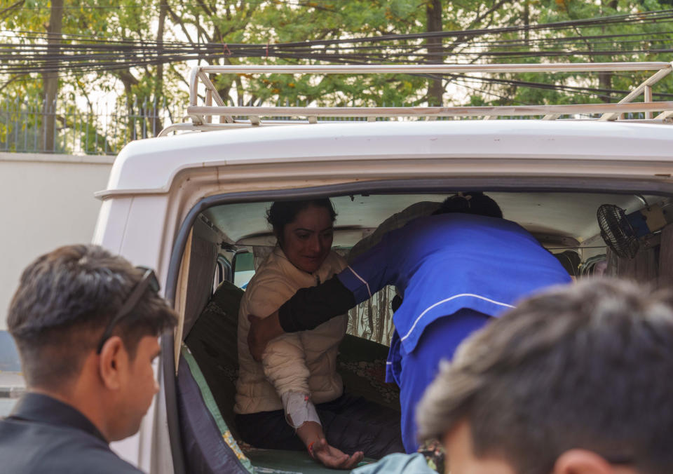 An injured Indian climber who was rescued from the Annapurna mountain region is brought to a hospital in Kathmandu, Nepal, Tuesday, April 18, 2023. An Irish climber died and an Indian is missing after falling into a crevasse in two separate incidents on Mount Annapurna, the world's 10th highest mountain, an expedition organizer said Tuesday. (AP Photo/Niranjan Shrestha)