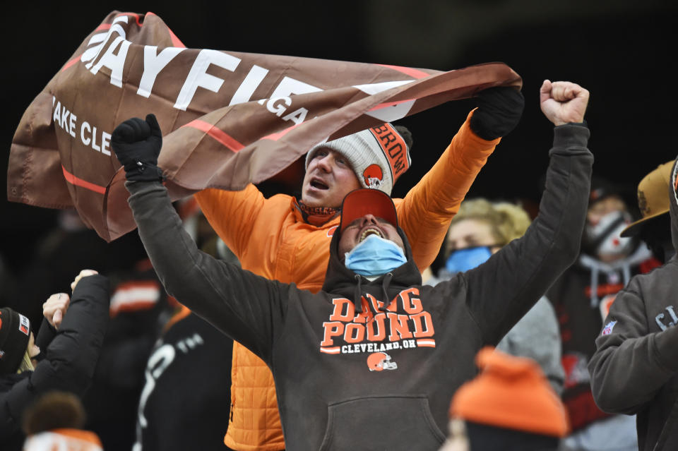 Cleveland Browns fans celebrate after the team defeated the Pittsburgh Steelers in an NFL football game, Sunday, Jan. 3, 2021, in Cleveland. (AP Photo/David Richard)