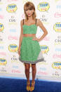 The starlet went for a fun look at the 2014 Teen Choice Awards, wearing a green Novis NYC Spring 2014 crop top and matching A-line skirt.