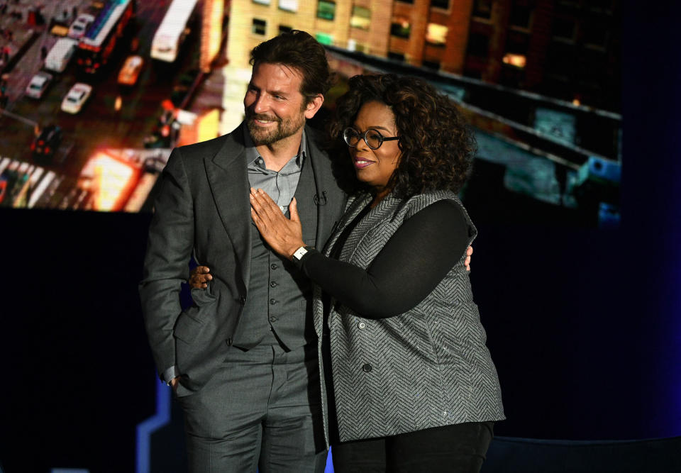 Bradley Cooper and Oprah Winfrey pose together during the talk show host's SuperSoul Conversations From Times Square. (Photo: Bryan Bedder via Getty Images)