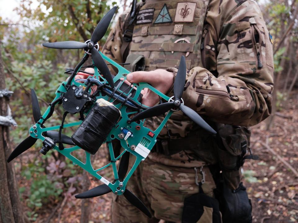 A serviceman of Separate 14th Regiment of Armed Forces of Ukraine, holds FPV strike drone on the front line on October 26, 2023 in Zaporizhzhia Oblast, Ukraine.