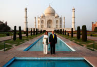 U.S. President Donald Trump and first lady Melania Trump pose as they tour the historic Taj Mahal, in Agra, India, February 24, 2020. REUTERS/Al Drago