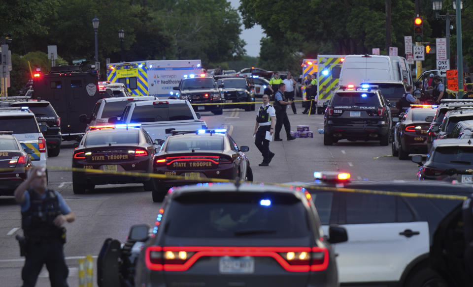 Investigators examine the scene of a shooting in Minneapolis, Thursday, May 30, 2024, following a fatal shooting. (Glen Stubbe/Star Tribune via AP)