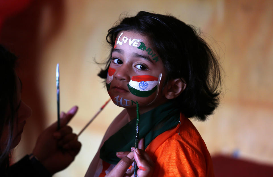 A school girl gets her face painted in the colors of India's national flag before taking part in the country's Republic Day celebrations in Jammu on&nbsp;Jan. 25, 2018. (Photo: Mukesh Gupta / Reuters)