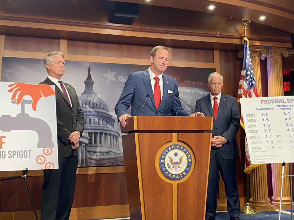 Missouri Republican U.S. Sen. Eric Schmitt speaks during a press conference on Capitol Hill on Wednesday, May 15, 2024. Kansas Republican Sen. Roger Marshall stands at the left and Wisconsin Republican Sen. Ron Johnson is on the right.