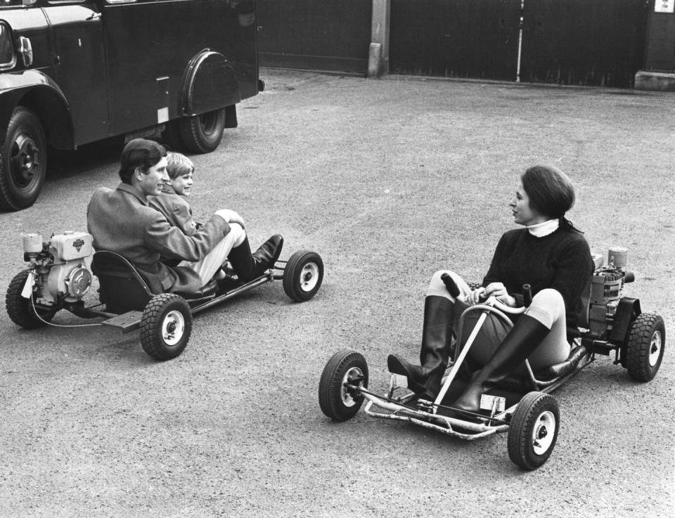 <p>Riding motorized go-karts with Prince Charles and Prince Edward.</p>