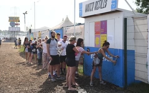 In a hot festival with very little shade, water was a precious commodity - Credit: Neil Hall/Rex