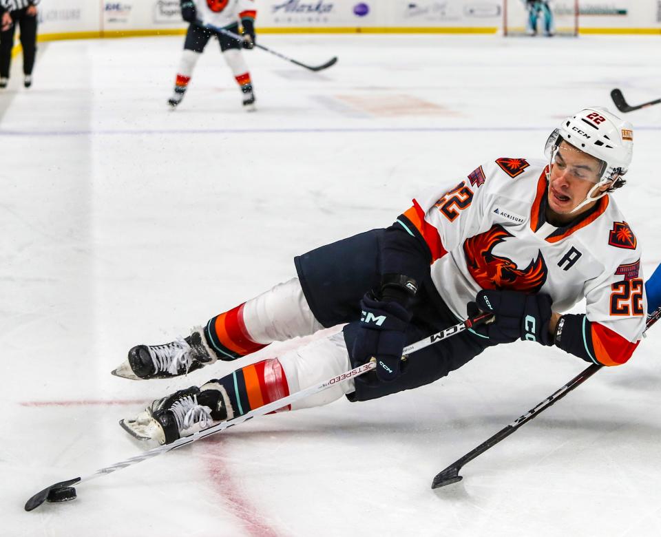 Coachella Valley forward Andrew Poturalski (22) takes a swing toward the goal as he slides out from his skates during the first period of their game at Acrisure Arena in Palm Desert, Calif., Wednesday, Jan. 4, 2023. 