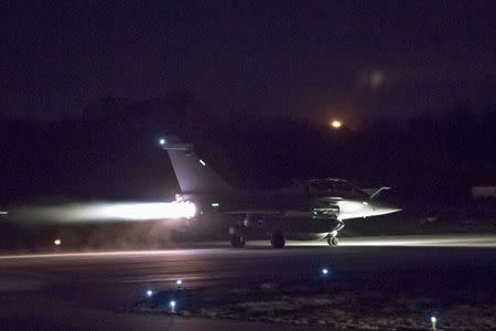 A plane preparing to take off as part of the joint airstrike operation by the British, French and U.S. militaries in Syria, is seen in this picture obtained on April 14, 2018 via social media. Courtesy French Military/Twitter/via REUTERS