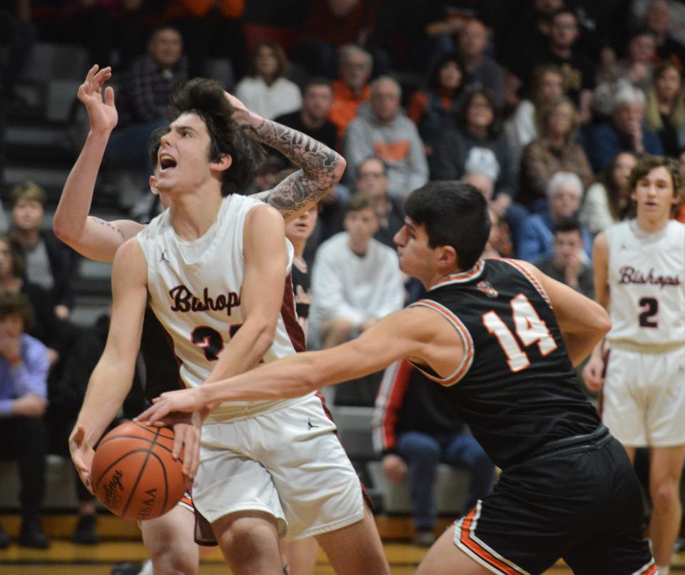 Rosecrans' Weston Hartman is fouled on his way to the hoop in the first half of a Division IV sectional final on Feb. 25 at Rogge Gymnasium. Strasburg won 68-52.