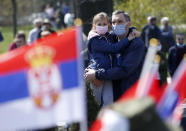 People attend a protest in front of the Serbian Parliament building in Belgrade, Serbia, Saturday, April 10, 2021. Environmental activists are protesting against worsening environmental situation in Serbia. (AP Photo/Darko Vojinovic)