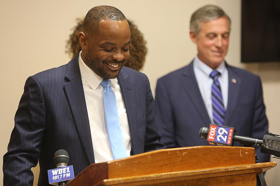 State Senator Darius Brown speaks at a bill signing ceremony on Monday August 7, 2023 as Governor John Carney (right) looks on.