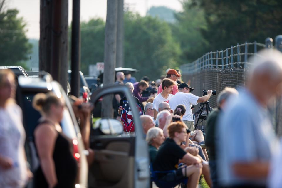 Residents wait near Dunton Park to watch the demolition of the James DeYoung Power Plant on Thursday, Aug. 10, 2023, in Holland.