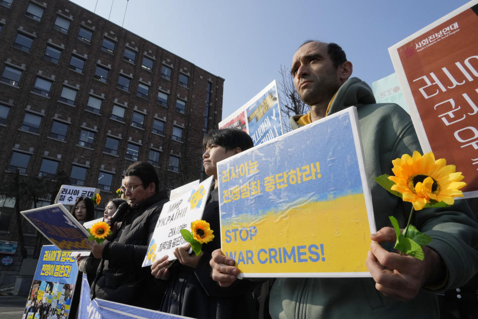 Protesters attend a rally to mark the one-year anniversary of Russia's invasion of Ukraine, near the Russian Embassy in Seoul, South Korea, Friday, Feb. 24, 2023. (AP Photo/Ahn Young-joon)