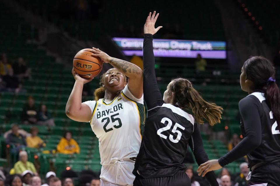 Baylor forward Kendra Gillispie (25) takes a shot as West Texas A&M forward Madison Kast (25) defends in the second half of an exhibition NCAA college basketball game in Waco, Texas, Wednesday, Nov. 3, 2021. (AP Photo/Tony Gutierrez)