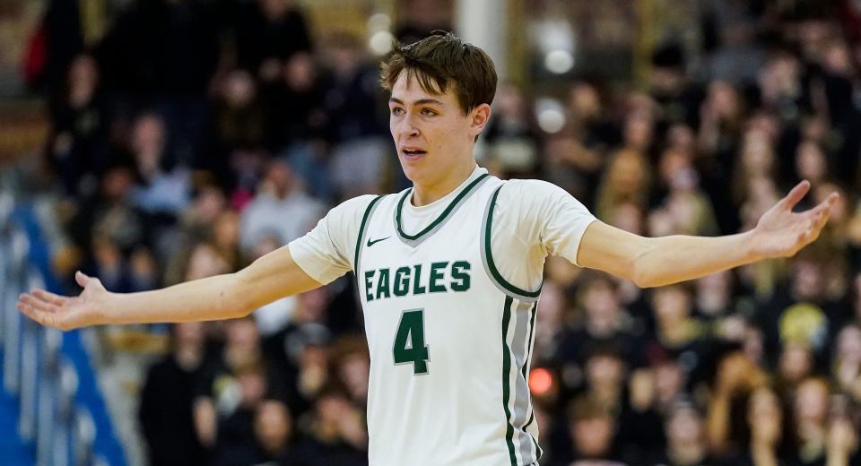 Zionsville Eagles guard Drew Snively (4) waves his arms to the crowd during the IHSAA Class 4A sectional final on Saturday, March 4, 2023 at Carmel High School in Carmel. The Noblesville Millers defeated the Zionsville Eagles, 58-50. 