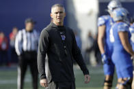 Memphis head coach Mike Norvell watches as players warm up before the start of an NCAA college football game against Cincinnati for the American Athletic Conference championship Saturday, Dec. 7, 2019, in Memphis, Tenn. (AP Photo/Mark Humphrey)