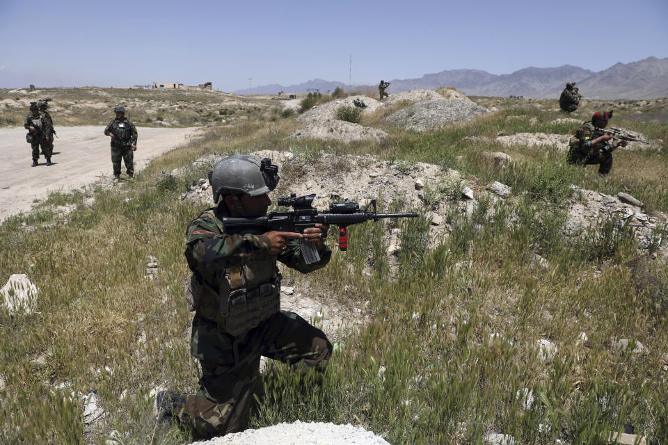 Afghan soldiers patrol outside their military base on the outskirts of Kabul, Afghanistan, Sunday, May 9, 2021. By Sept. 11 2021, at the latest, the remaining U.S.and allied NATO forces will leave Afghanistan, ending nearly 20 years of military engagement. Also leaving is the American air support that the Afghan military has relied on to stave off potentially game-changing Taliban assaults, ever since it took command of the war from the U.S. and NATO in 2014. (AP Photo/Rahmat Gul)