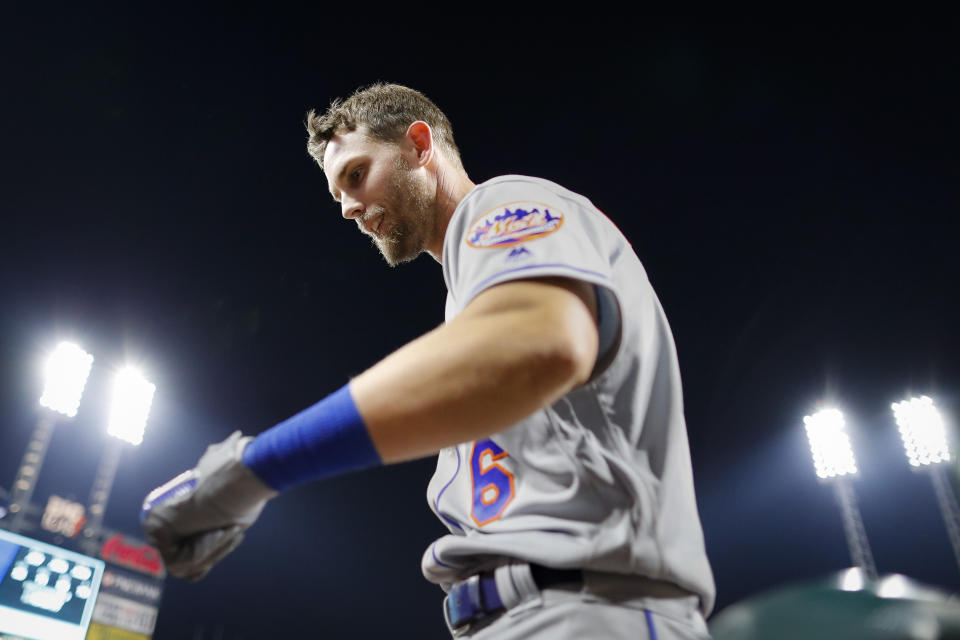 New York Mets' Jeff McNeil celebrates after hitting a solo home run off Cincinnati Reds starting pitcher Luis Castillo in the sixth inning of a baseball game Friday, Sept. 20, 2019, in Cincinnati. (AP Photo/John Minchillo)