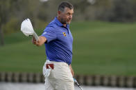 Lee Westwood, of England, celebrates after making a putt on the 18th hole during the third round of The Players Championship golf tournament Saturday, March 13, 2021, in Ponte Vedra Beach, Fla. (AP Photo/Gerald Herbert)