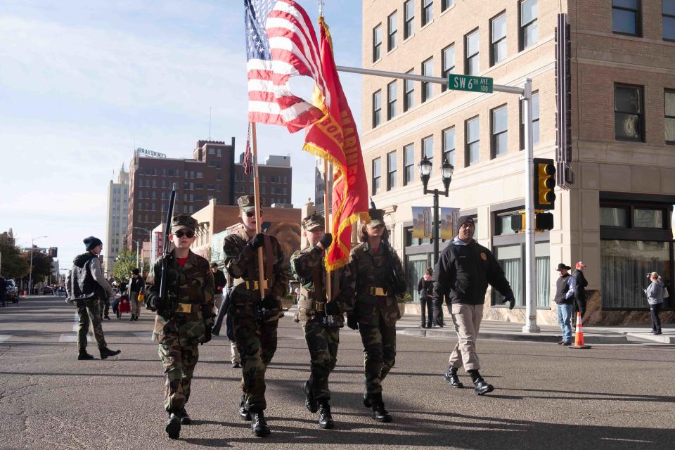 Bomb City Young Marines color guard walks past the crowd on Polk Street during the 2022 Amarillo Veterans Day Parade in downtown Amarillo in this file photo. This year's parade is Saturday morning.