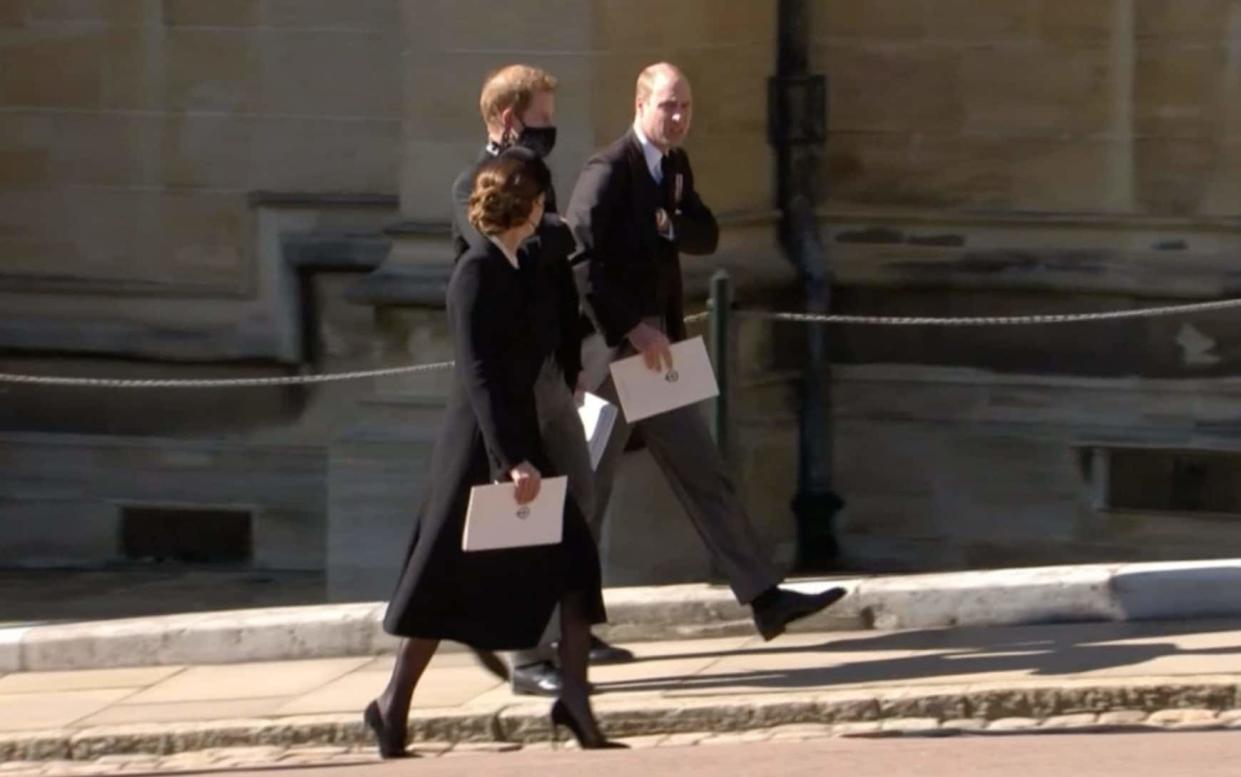 Prince Harry and William chat following the service at Windsor