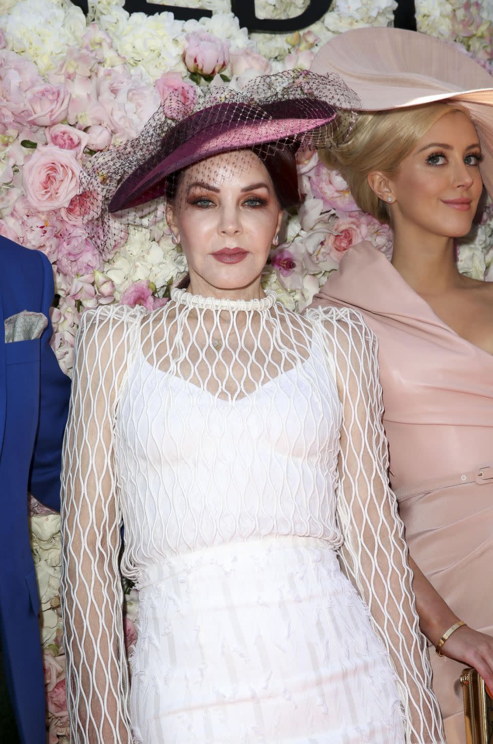 Priscilla looked flawless as she posed in front of a flower wall. Photo: Media Mode