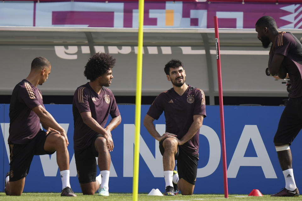 Germany's Thilo Kehrer, Serge Gnabry, Ilkay Gundogan and Antonio Ruediger warm up for a training session at the Al-Shamal stadium on the eve of the group E World Cup soccer match between Germany and Japan, in Al-Ruwais, Qatar, Tuesday, Nov. 22, 2022. Germany will play the first match against Japan on Wednesday, Nov. 23. (AP Photo/Matthias Schrader)