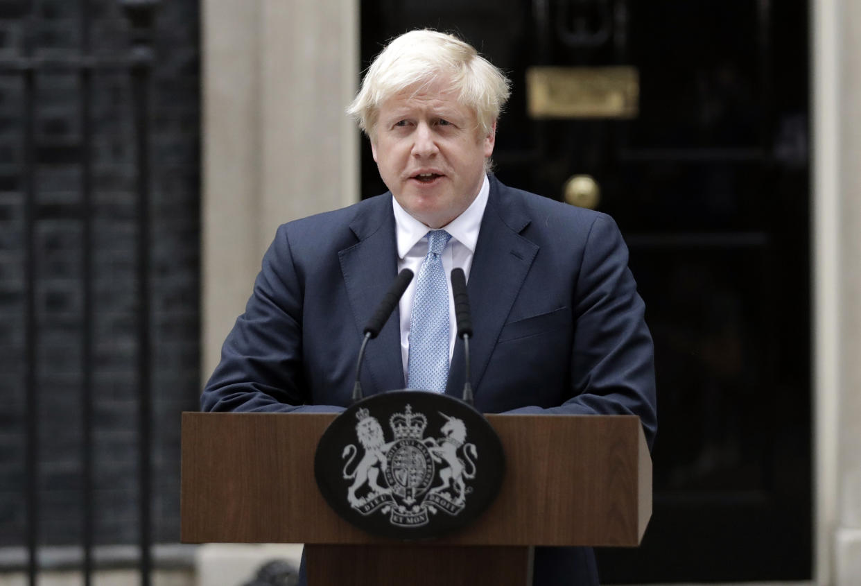 Britain's Prime Minister Boris Johnson speaks to the media outside 10 Downing Street in London, Monday, Sept. 2, 2019. Johnson says chances of a Brexit deal are rising .(AP Photo/Matt Dunham)