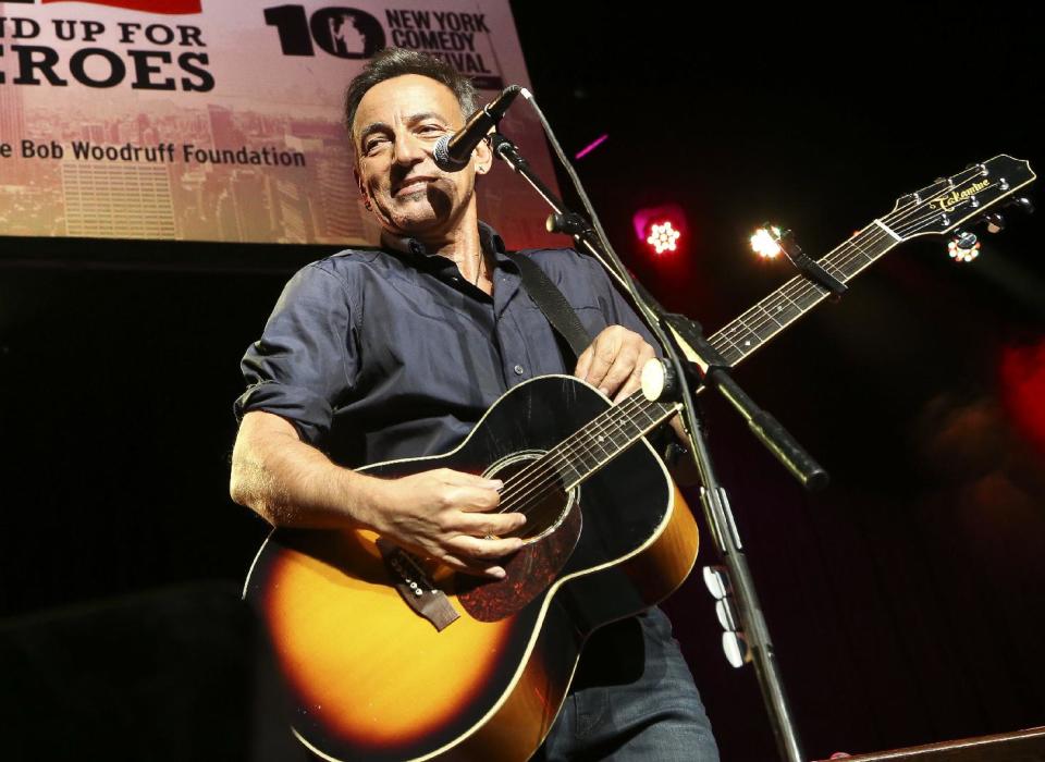 FILE - In this Nov. 6, 2013 file photo, musician Bruce Springsteen performs at the Stand Up for Heroes event at Madison Square Garden, in New York. The Boss himself will close out three days of performances in Dallas that will keep NCAA Final Four fans rocking. Andrew Dost of the pop-rock trio fun., which will take the stage before Bruce Springsteen and the E Street Band on Sunday, April 6, 2014, says, “I’m really excited just for the energy that will be in town, to be part of that energy.” (John Minchillo/Invision/AP, file)