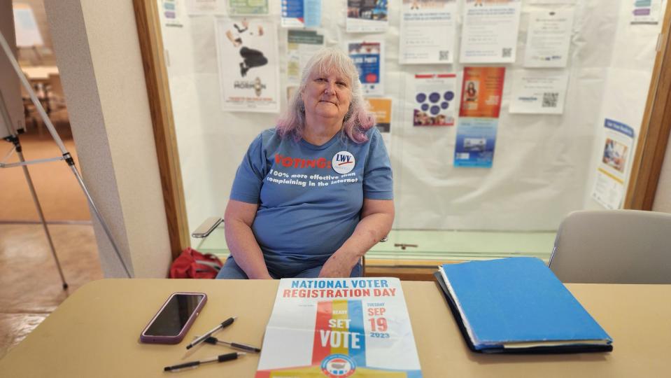 Co-President of the League of Women Voters, Michelle Hoggatt, stands by to register voters Tuesday at the Amarillo North Library during National Voter Registration Day.