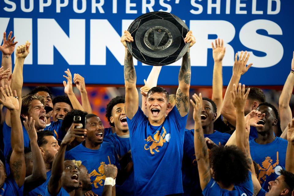 FC Cincinnati forward Brandon Vázquez  holds up the Support’s Shield following the MLS match between FC Cincinnati and New York Red Bulls in October. Vazquez is under contract but could still end up playing in Europe next season.