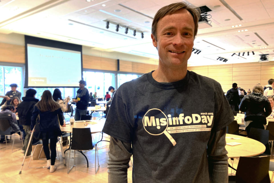 Jevin West, co-founder of the University of Washington's Center for an Informed Public, poses for a picture during MisinfoDay, an event West created to help high school students identify and avoid misinformation, Tuesday, March 14, 2023, in Seattle. Educators around the country are pushing for greater digital media literacy education. (AP Photo/Manuel Valdes)