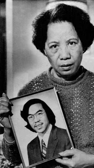 Lily Chin holds a photograph of her son Vincent, 27, who was beaten to death on June 23, 1982, in a photo made Nov. 2, 1983.