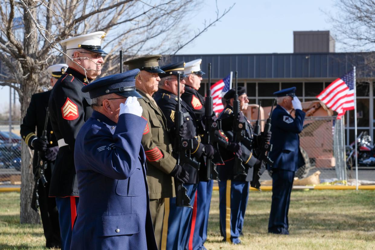 The Veterans Honor Guard render honors Wednesday at the Texas Panhandle War Memorial Center ceremony honoring the transport of eight veterans' remains to Sam Houston National Cemetery in San Antonio.