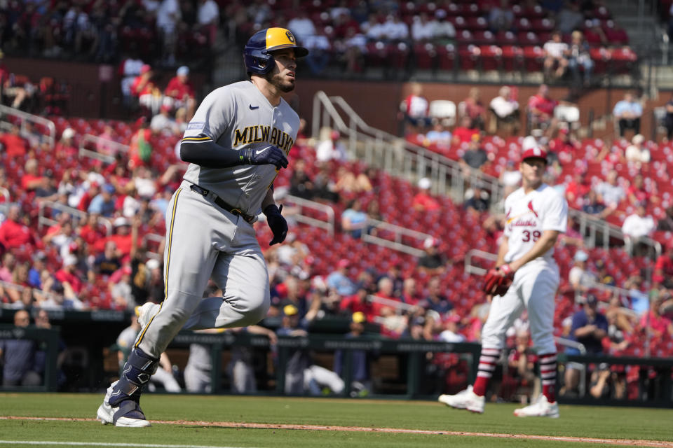 Milwaukee Brewers' Victor Caratini, left, rounds the bases after hitting a three-run home run off St. Louis Cardinals starting pitcher Miles Mikolas during the sixth inning of a baseball game Thursday, Sept. 21, 2023, in St. Louis. (AP Photo/Jeff Roberson)