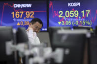 A currency trader watches monitors at the foreign exchange dealing room of the KEB Hana Bank headquarters in Seoul, South Korea, Tuesday, Sept. 17, 2019. Shares were mostly lower in Asia on Tuesday after an attack on Saudi Arabia’s biggest oil processing plant caused crude prices to soar, prompting selling of airlines and other fuel-dependent industries. (AP Photo/Ahn Young-joon)