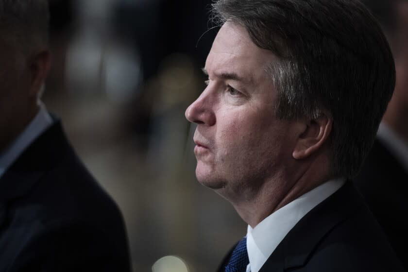 FILE - In this Dec. 3, 2018 file photo, Supreme Court Associate Justice Brett Kavanaugh is seen at the Capitol on Capitol Hill in Washington. The Supreme Court says Justice Brett Kavanaugh has tested positive for COVID-19. (Jabin Botsford/The Washington Post via AP, Pool)