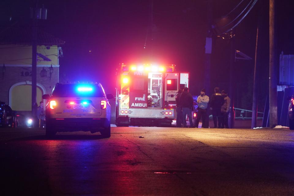 Police at the scene where a New Jersey State Trooper was shot on Ninth Avenue near E29th Street in Paterson around 1 a.m. on March 2, 2023.