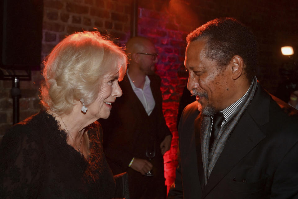 Britain's Camilla, Queen Consort talks with shortlisted author Percival Everett during the Booker Prize at the Roundhouse in London, Monday Oct. 17, 2022. (Toby Melville/Pool via AP)