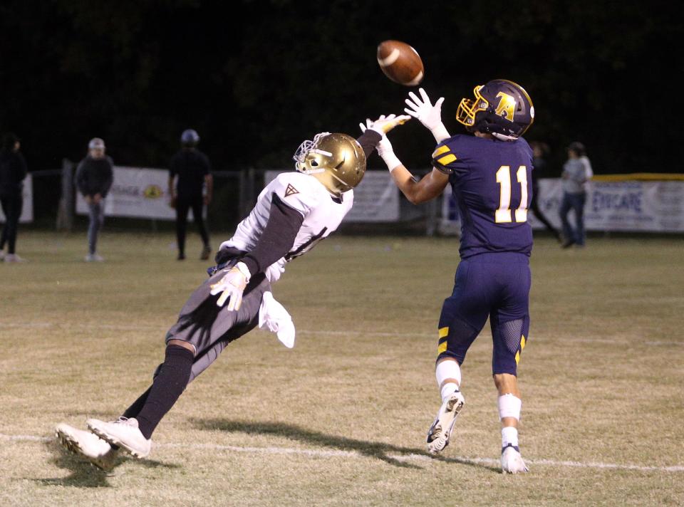 Jack Standeffer (11) catches a pass over Xavier Dunn (13) and runs the ball into the end zone for Tuscaloosa Academy's first touchdown again Valiant Cross Academy in the first quarter during a game at Tuscaloosa Academy Friday, Nov. 5, 2021. Photo / Michelle Lepianka Carter