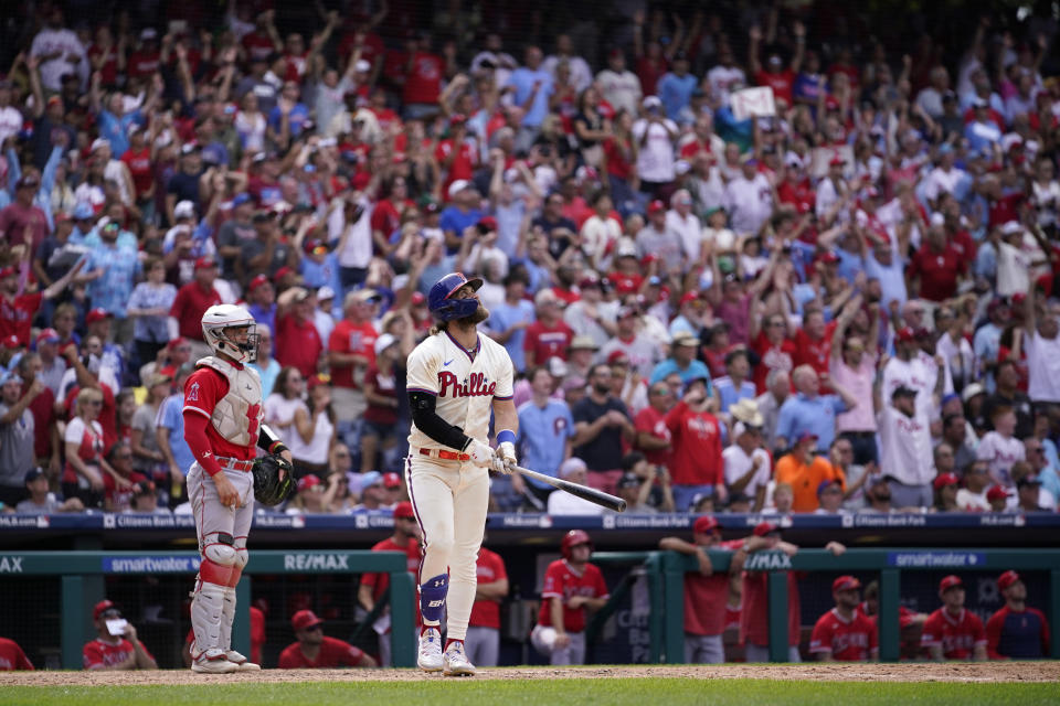 Philadelphia Phillies' Bryce Harper watches after hitting a two-run home run against Los Angeles Angels pitcher Matt Moore during the eighth inning of a baseball game, Wednesday, Aug. 30, 2023, in Philadelphia. (AP Photo/Matt Slocum)