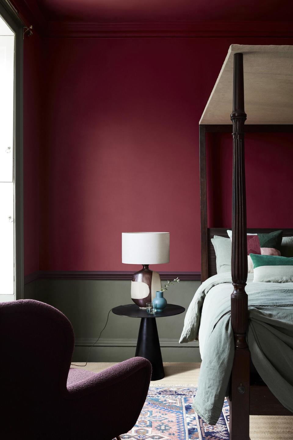 Baked Cherry, a deep red that’s part of Little Greene’s debut American palette, adorns a bedroom wall