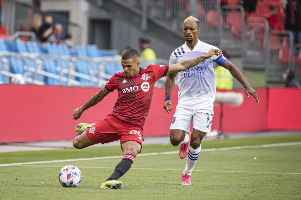 Orlando City SC forward Nani (17) chases Toronto FC defender Auro (96) during first-half MLS soccer match action in Toronto, Saturday, July 17, 2021. (Chris Katsarov/The Canadian Press via AP)