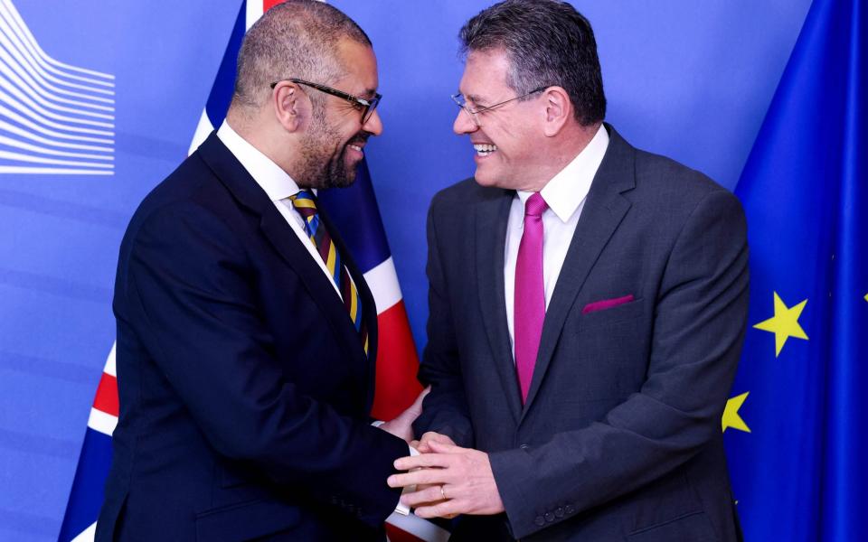 James Cleverly, the Foreign Secretary, shakes hands with Maros Sefcovic, the vice president of the European Commission, in Brussels today - Kenzo Tribouillard/AFP